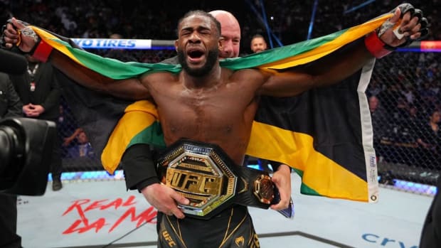 Aljamain Sterling celebrates after defeating Petr Yan in their bantamweight unification title fight at UFC 273.